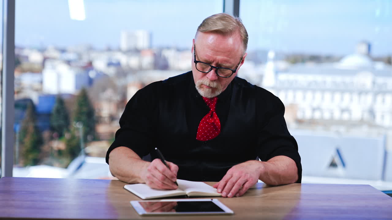 Stylish handsome businessman working in the office. Mature middle age in casual cloth.