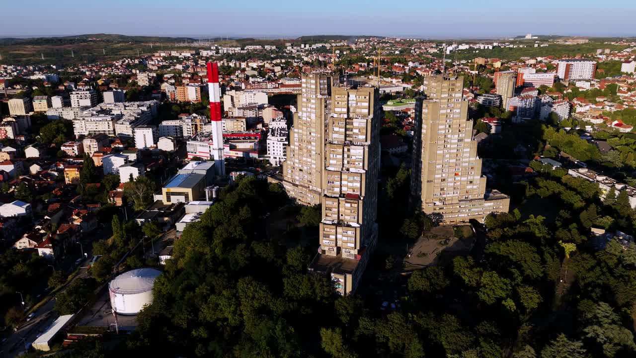 Aerial view of Eastern Gate in Belgrade, Serbia. Brutalist residential towers, raw concrete textures, and a panoramic view of the capital’s skyline