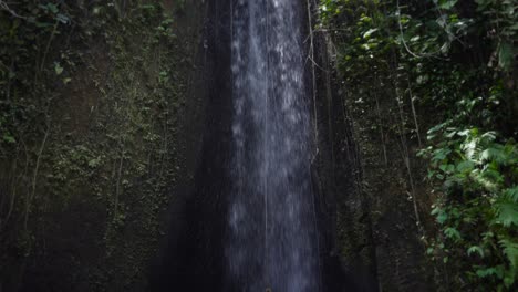 beautiful woman bikini swimsuit at bali landmark waterfall sumampan tropical nature