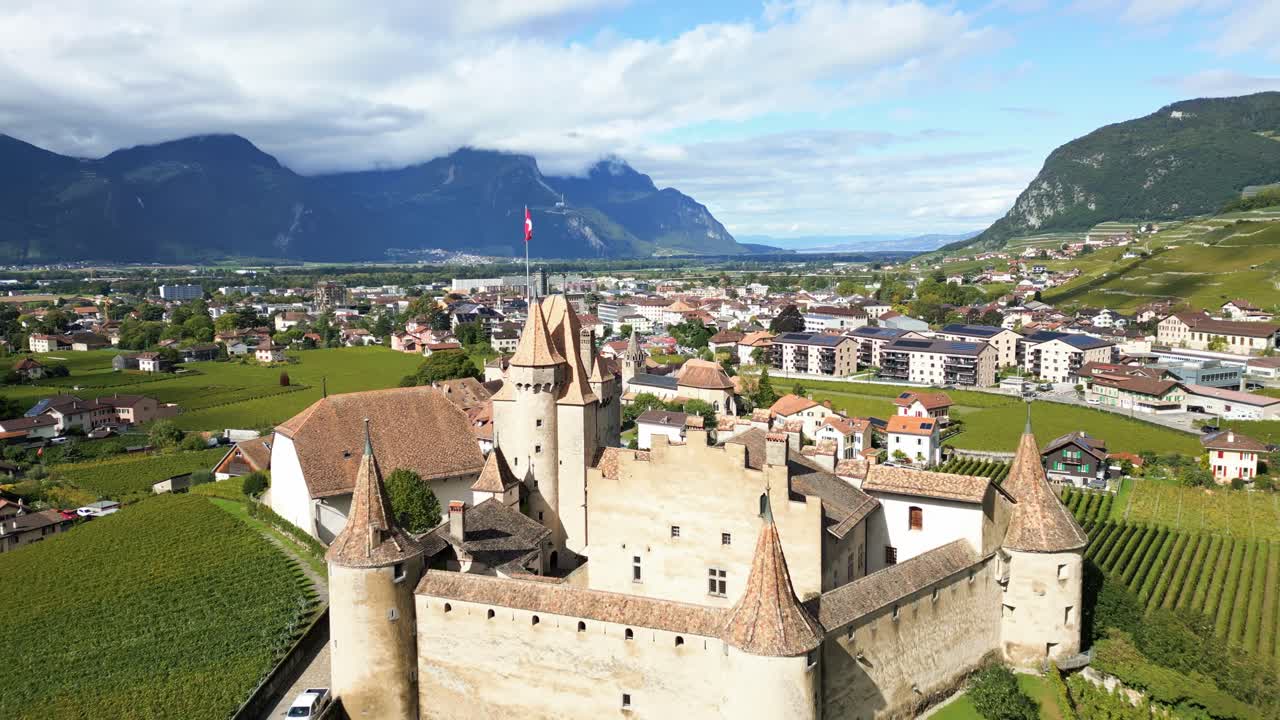 Aerial View of a Swiss Castle in a Vineyard Valley
