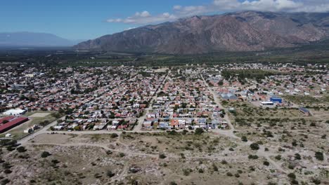 aerial: cafayate town in argentina mountains is wine producing region