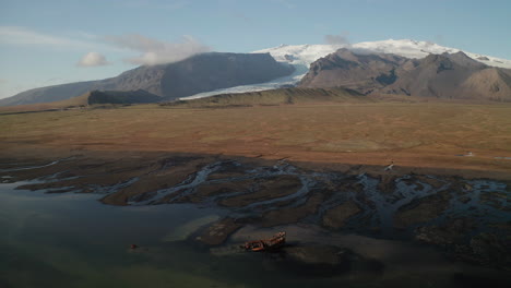 View-over-FV-Clyne-Castle-Steam-Trawler-shipWreck-and-Kviarjokull-Glacier-Outlet---Breidamerkursandur---South-of-Iceland
