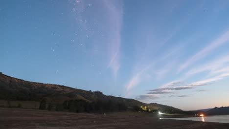 southern milky way rises spectacularly over a a lake in nsw