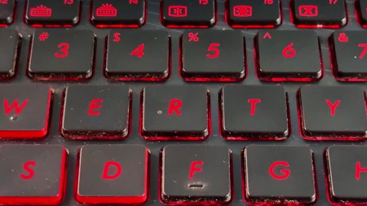 Laptop keyboard typing in "R" close-up with finger interaction, highlighting productivity, work, and digital communication