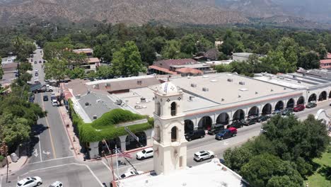 Aerial-wide-reverse-pullback-shot-of-charming-downtown-Ojai,-California