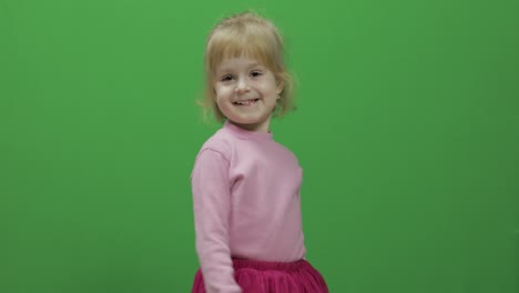 Happy-three-years-old-girl.-Cute-blonde-child.-Dancing-and-make-faces