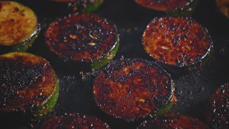 fried slices of zucchini in a pan. closeup