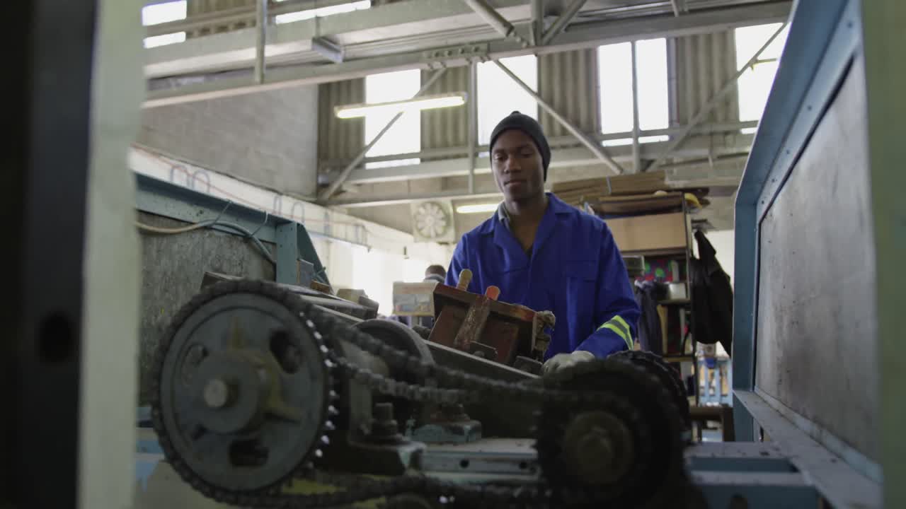 Mixed race man working in factory