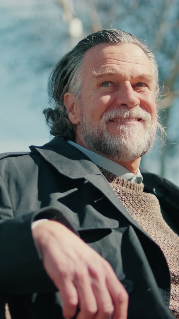 Happy Senior Man Enjoying Sunny Day In Park