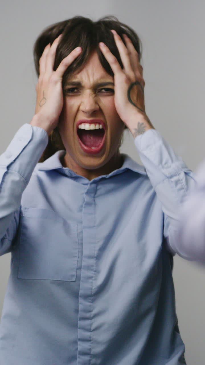 Frustrated Woman Screaming and Pulling Her Hair in Despair