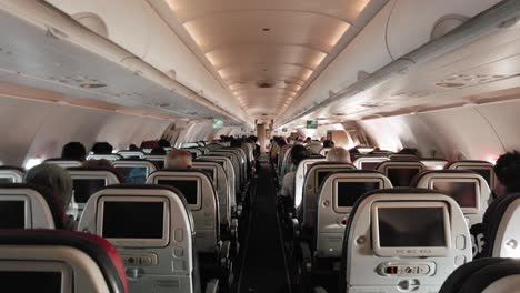airplane cabin filled with passengers