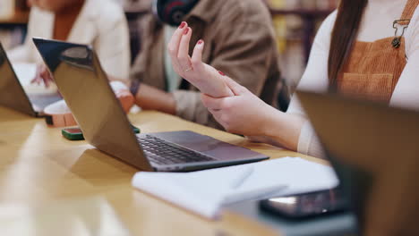 people working at a table with laptops