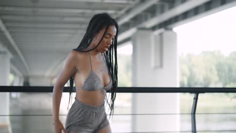 woman dancing on a bridge