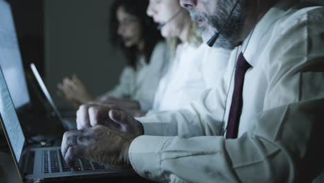 Call-center-workers-using-laptops