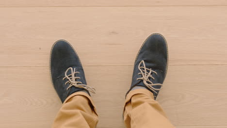 above view man wearing shoes enjoying stylish footware standing on wooden floor