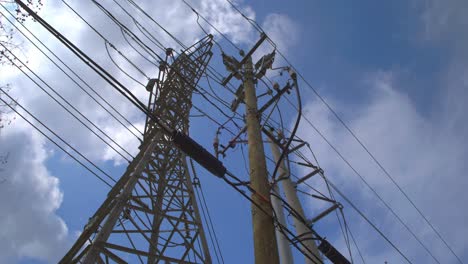 fast-moving clouds over tall electricity utility pole – 4k timelapse