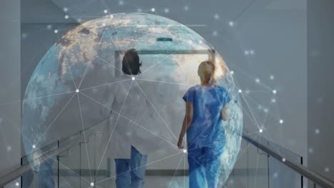 animation of connected dots around globe over rear view of female doctors running to emergency room