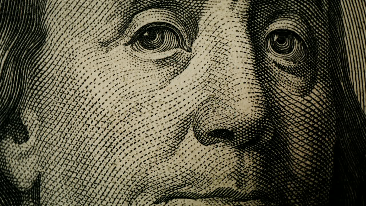 Close-up of George Washington's portrait on a one dollar bill