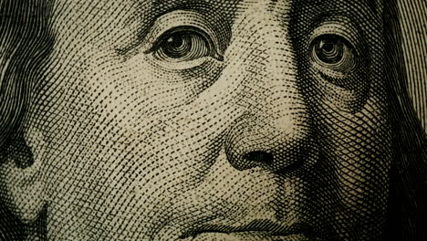 close-up of george washington's portrait on a one dollar bill