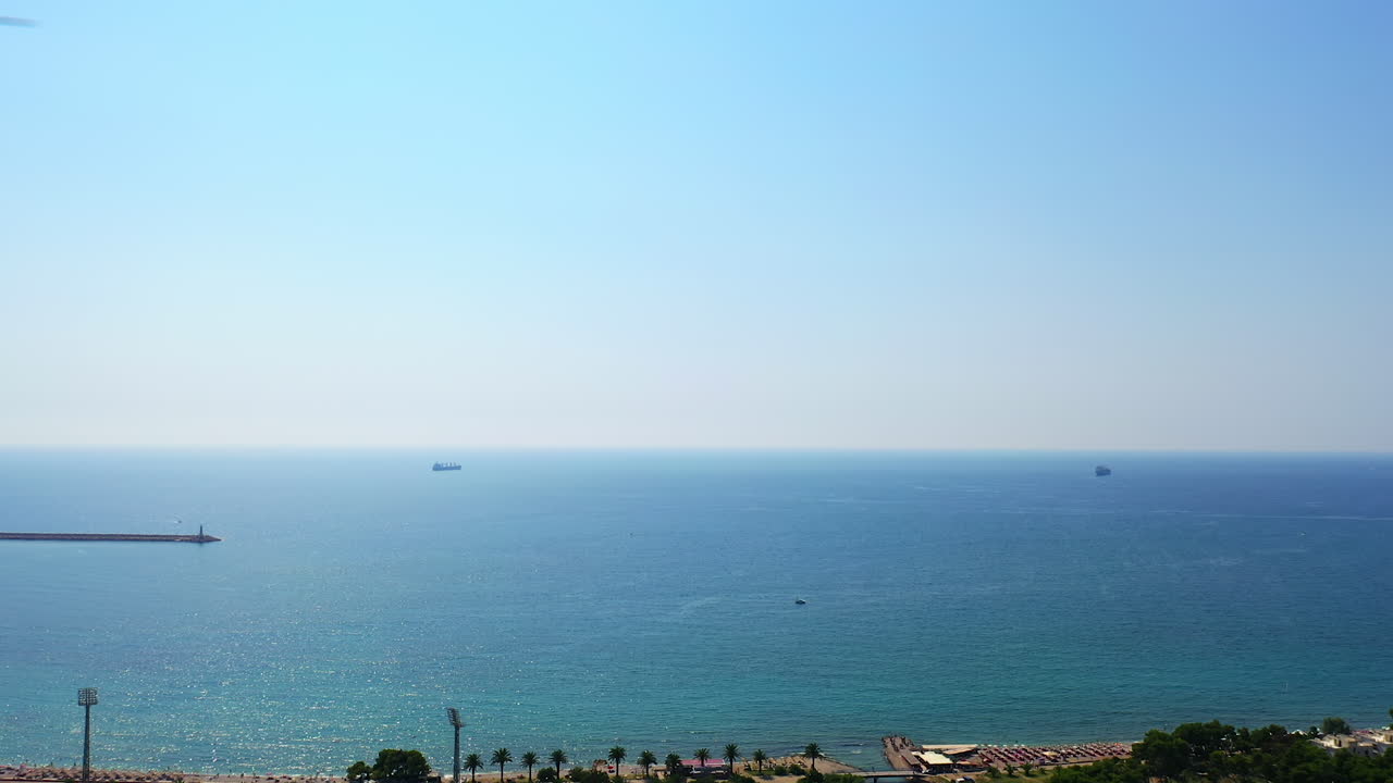 Adriatic Sea at the shore of Montenegro. Beautiful sunny day footage from drone.