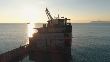 rusty shipwreck at sunset