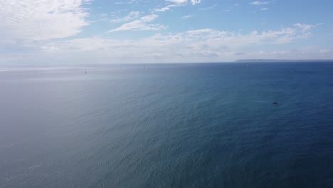 ship catamaran sailing on mediterranean sea, aerial beautiful skyline