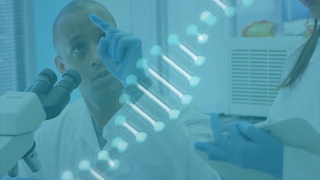 animation of dna strand over biracial male scientist using microscope