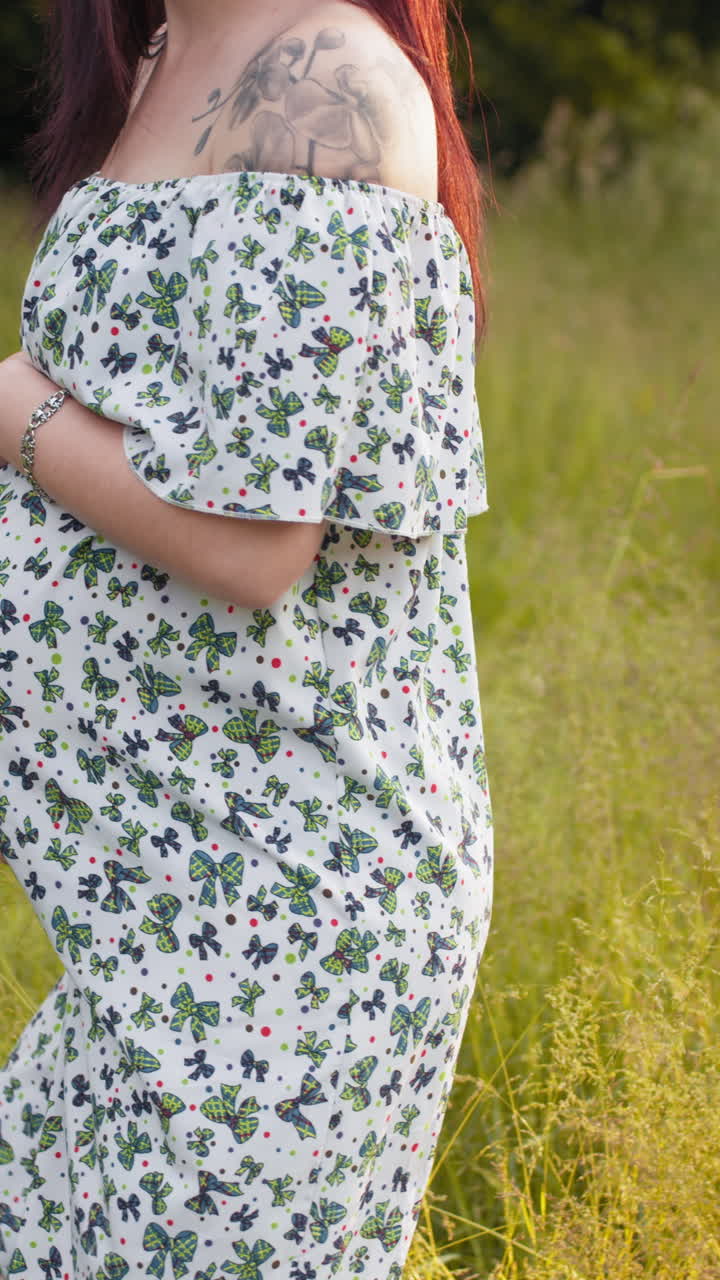 Pregnant woman in summer dress vertical video