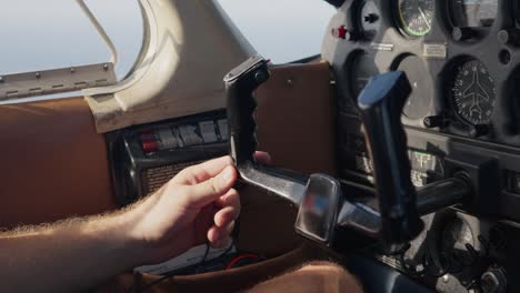 aircraft pilot driving the airplane, holding the airplane yoke