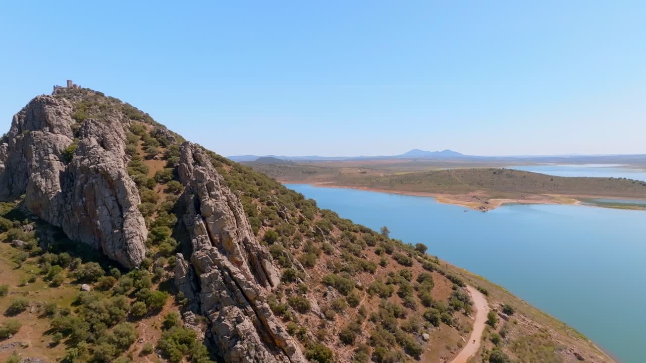 Flying over the jagged rock surface of Culebra Hill on the bank of the Matachel River
