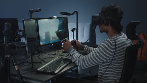 man playing vr game on computer setup