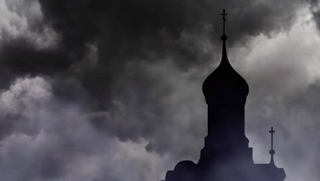 silhouette-of-church-against-dark-clouds-background