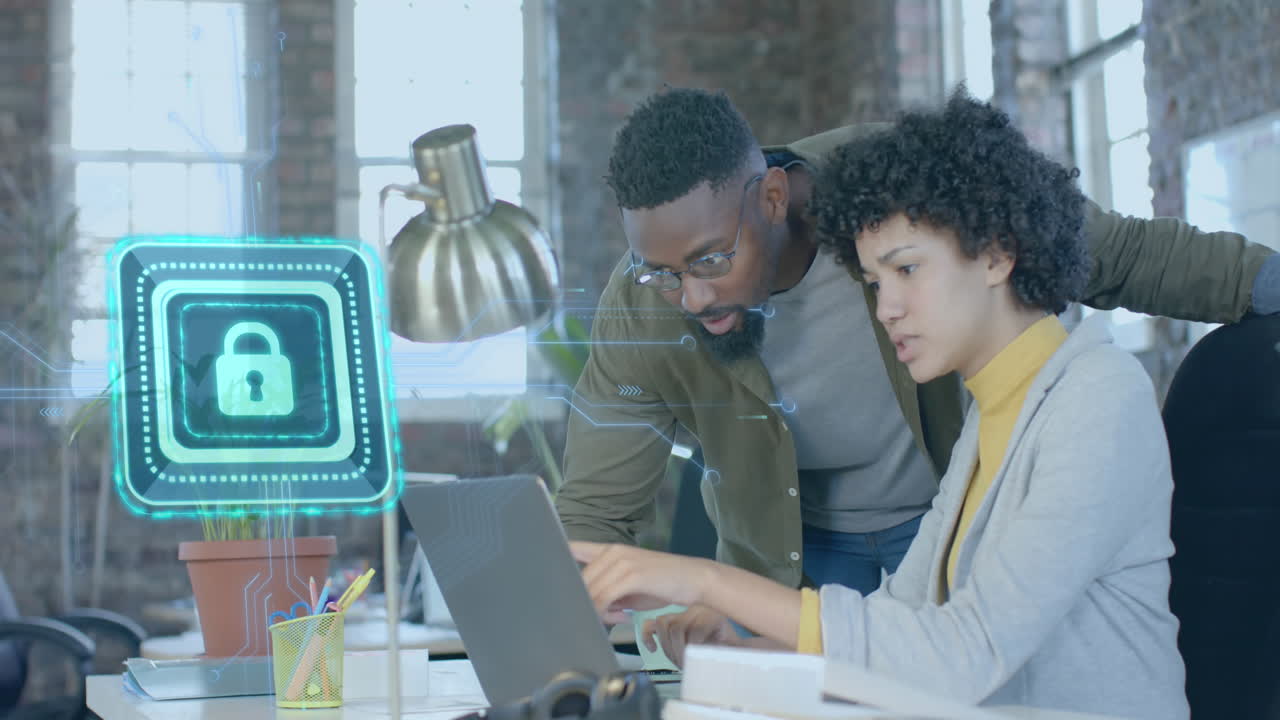 Animation of digital padlock over diverse colleagues working in office