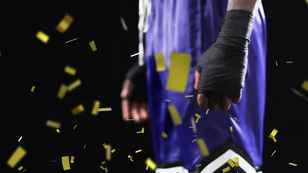 검은색 배경에 아프리카계 미국인 남성 권투 선수 위에 떨어지는 콘페티의 애니메이션