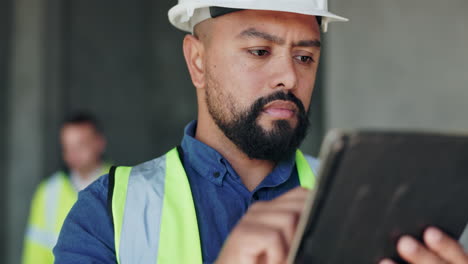 construction worker using tablet on site