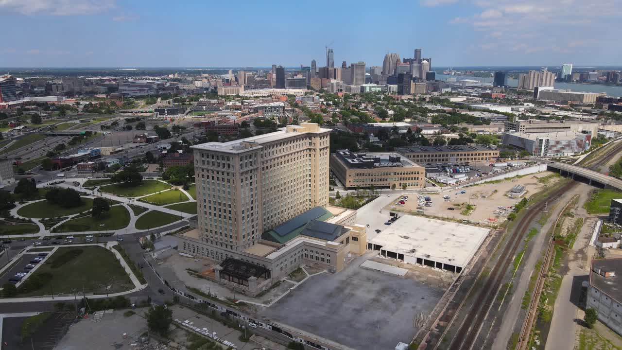 Recently restored Michigan Central Station building with Detroit skyline in the background