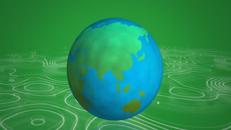 globo giratorio contra la topografía en fondo verde