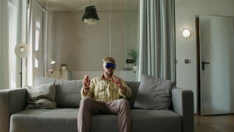 man using vr headset at home