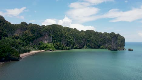 aerial timelapse of limestone cliffs and moving clouds at ao nang beach