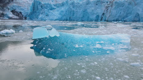 flying above floating melting icebergs at dawes glacier, endicott arm fjord, inside passage, alaska