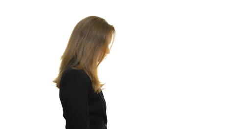 A-side-profile-of-a-woman-wearing-a-black-blazer-jacket,-tilting-her-head-back-on-a-seamless-white-studio-background