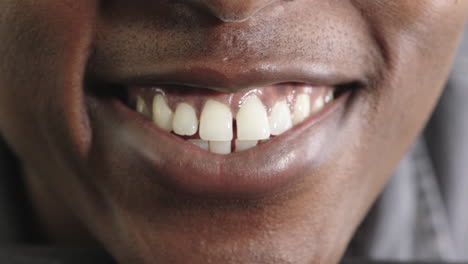 close up african american man mouth smiling showing healthy white teeth dental health concept hygiene clean