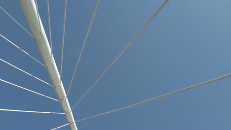 abstract view of a bridge against a clear blue sky