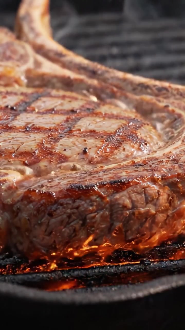 A Visual Journey Through The Art of Grilling: Perfectly Charred Steaks on a Sizzling Grill, Capturing the Juicy Essence of Barbecue Cooking Techniques