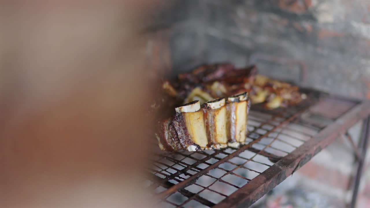 Close-up of BBQ ribs grilled on rustic grill, authentic Latin American cuisine