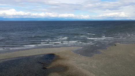 Breaking-waves-of-the-pacific-ocean-being-filmed-in-4k-from-above-on-a-windy-day