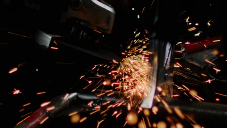 Brilliant-orange-sparks-erupt-wildly-from-the-tool's-operation,-creating-a-mesmerizing-spectacle