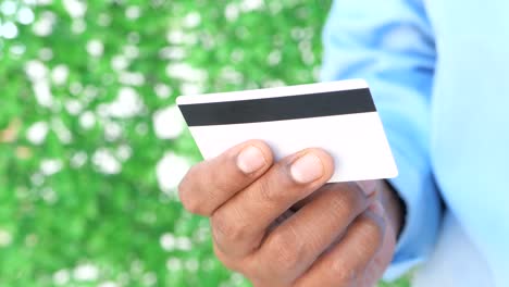 person holding a credit card