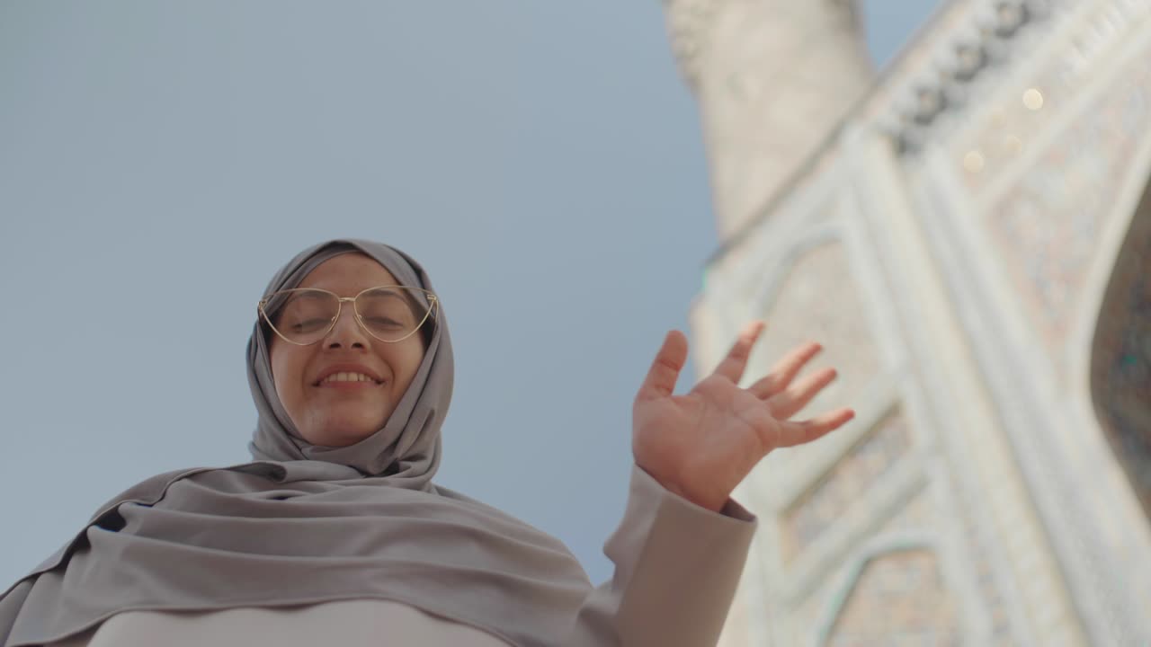 Portrait of Mixed-race Woman near Mosque