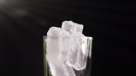 a showcase of the rotation ice in glass close up of cold with slow motion rotating